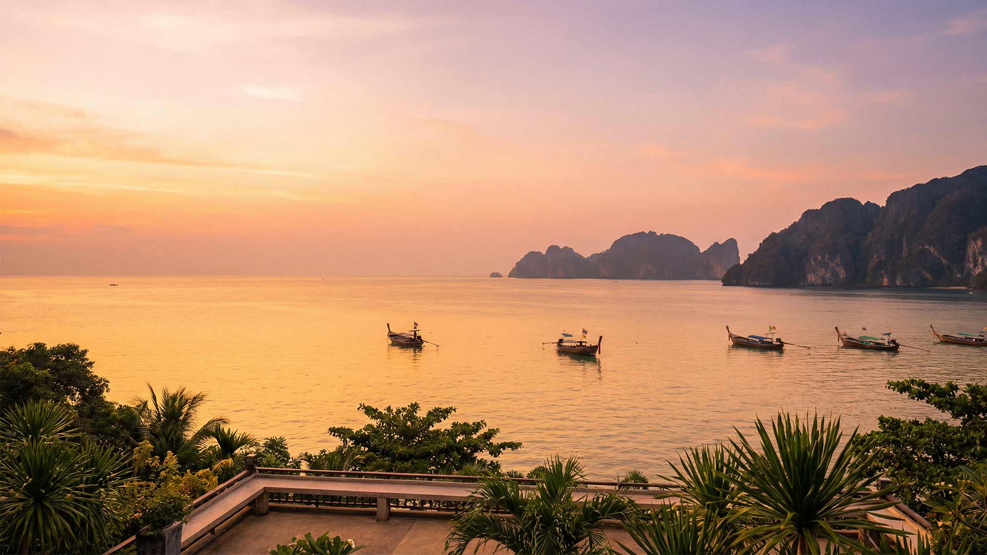 Phuket sunset view with longtail boats representing business growth and freedom