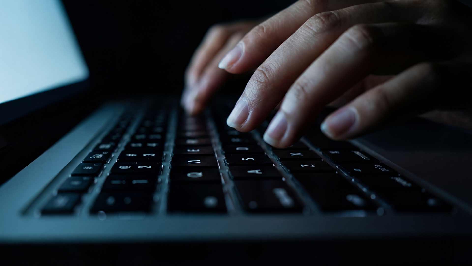 SEO strategist analyzing keyword research data on laptop in Phuket office